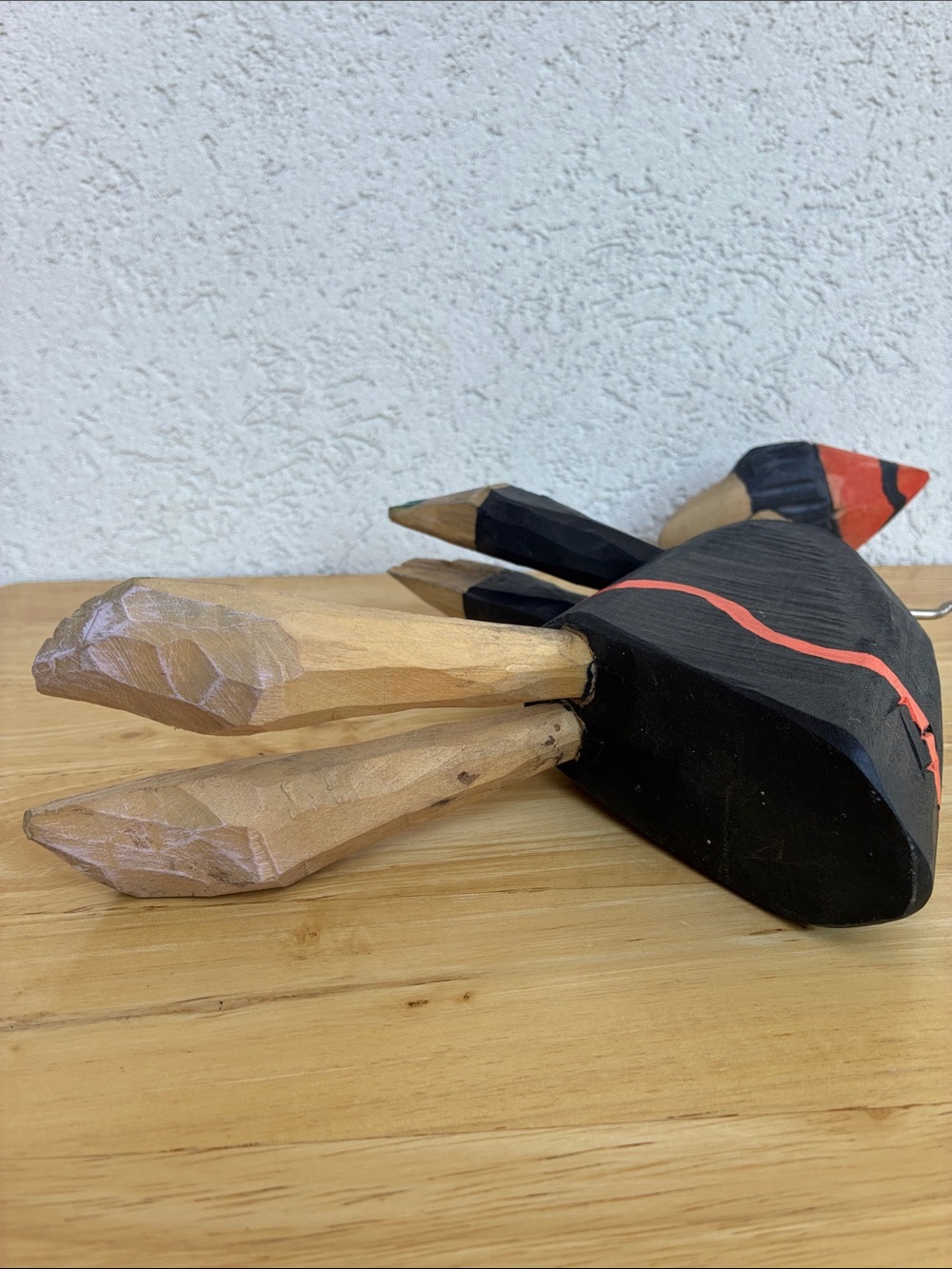 Strange hand carved folk art character with bland and orange clothes and a hook - Picture 9 of 13